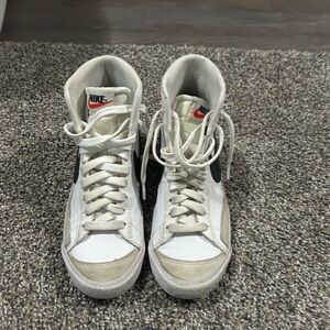 Nike White and Black High-Top Sneakers with Orange Logo